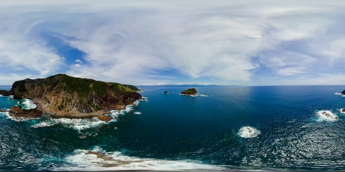 Sea surf and waves on the tropical coast. Ocean and islands. Monoscopic image. Anyao island. Baler, Aurora. Philippines.