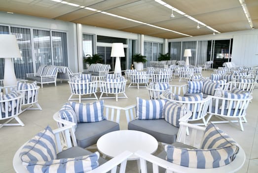 lounge with striped sofas and tables