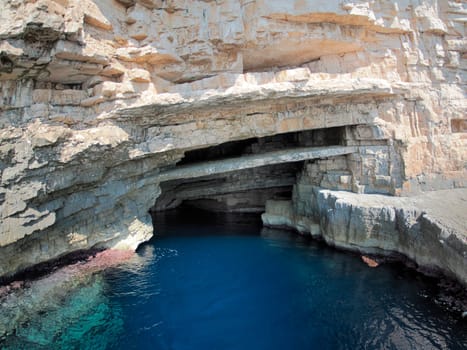 vis island croatia turquoise water and rock cliff, transparent clear sea water during a bright summer day