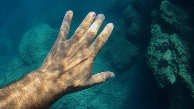 open palm human hand underwater detail close up