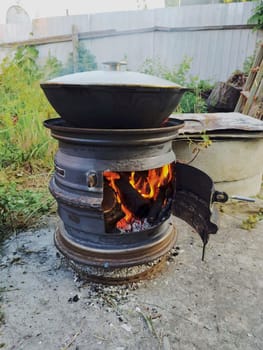 There is a cauldron with pilaf on it.Cooking.