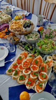 The laid table is replete with food and snacks. Before New Year's celebrations.