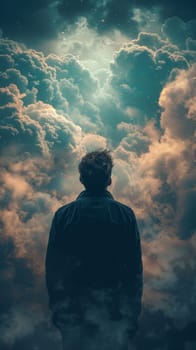 A man standing in the clouds looking up at a sky full of stars