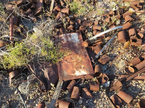 Can Dump and Rusty Shelf at Abandoned Mine Site in Arizona Desert. High quality photo