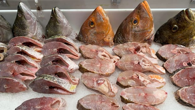 Slices of fish covered with ice in wet market. Seafood concept.