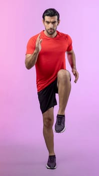 Full body length gaiety shot athletic and sporty young man fitness running cardio exercise posture on isolated background. Healthy active and body care lifestyle.