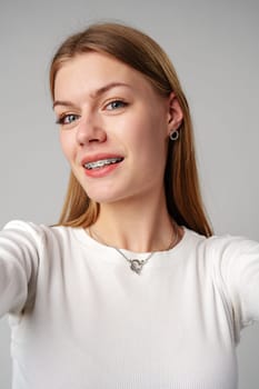 Young woman with dental braces close up photo