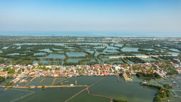 Aerial view of Aquaculture farm and village in the countryside of the Philippines.