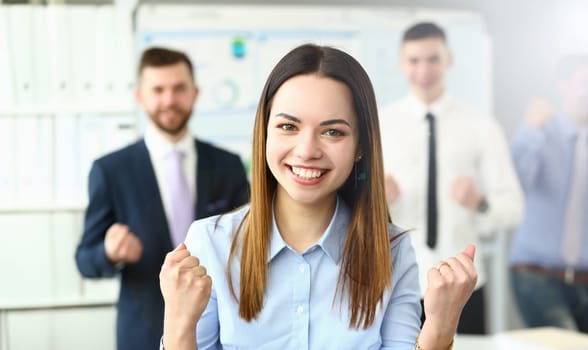 Smiling beauty businesswoman office portrait standing on group business peoples background. Demonstrates joy winning end reporting period education completion affairs and energy concept