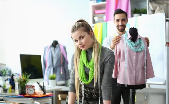 Dressmaking Process Exclusive Clothes Creation. Man Creative Designer Working with Fashion Dummy. Caucasian Seamstress with Measuring Tape over Neck Looking at Camera. Manufacturing in Tailor Workshop