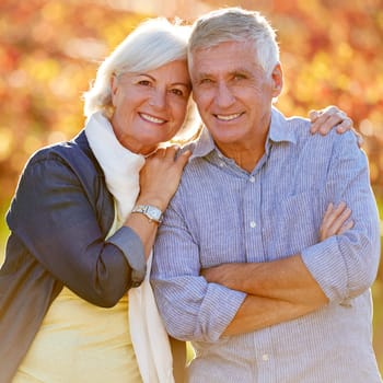 Love, portrait and senior couple hug in a park with trust support and care, fun and bonding in nature. Travel, happy and face of elderly people at vineyard for anniversary, celebration or vacation.