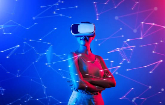 Female standing wearing white VR headset and sleeveless connecting metaverse, future cyberspace technology, posing crossed arms with neon light look like she living in cyberpunk age. Hallucination.