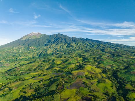 Aerial drone of Canlaon volcano and farmland on the mountain slopes. Negros, Philippines