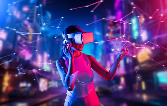 Smart female standing in cyberpunk style building in meta wear VR headset connecting metaverse, future cyberspace community technology, Woman use index fingers touching virtual object. Hallucination.