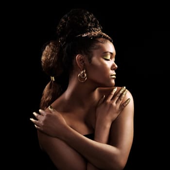 Black woman, beauty and creative in studio with gold, jewellery and aesthetic on black background. Glitter, makeup and female model for luxury cosmetics, designer and rich fantasy for cosplay