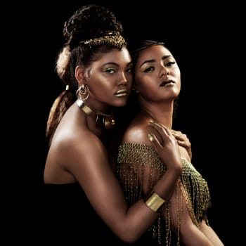 Beautiful women, in gold jewellery and studio portrait with black background for luxury, glamour or elegant fashion. Sisters, royal and proud together for empowerment, cosmetics and accessories.