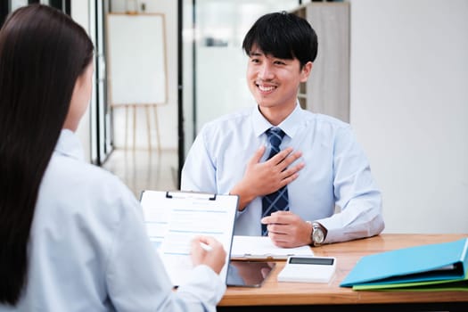 A candidate engaged in a job interview with a hiring manager, discussing qualifications and employment opportunities.