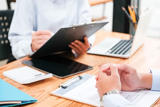 A candidate engaged in a job interview with a hiring manager, discussing qualifications and employment opportunities.