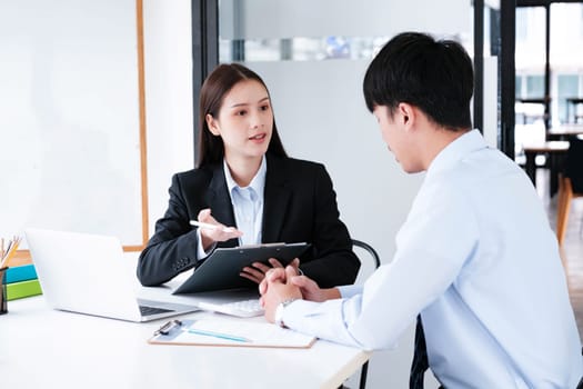 A candidate engaged in a job interview with a hiring manager, discussing qualifications and employment opportunities.