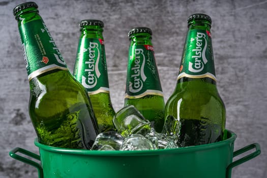 Antalya, Turkey – April 4, 2024: Carlsberg Beer bottles in bucket with ice
