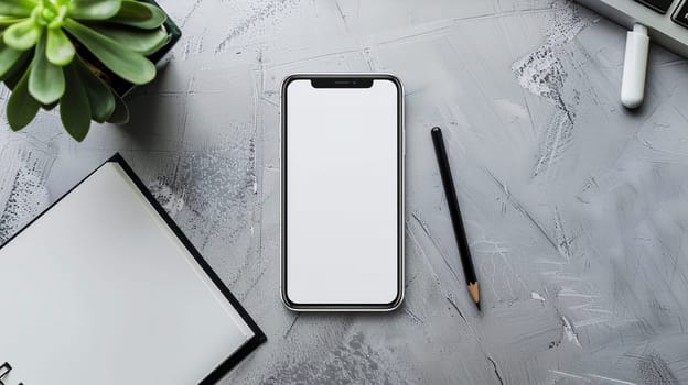 Smartphone mock-up lies on textured desk surface near stationery, green succulent, and blank notepad, creating minimalist workspace scene.