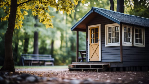 A small cabin in the woods with a door and windows