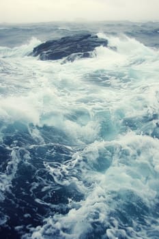 A person riding a surfboard in rough ocean waters