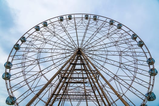 a large Ferris wheel on a blue sky background. photo