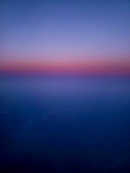 View of a Man-made Lake Seen From an Airplane at Sunrise