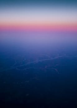 View of a Man-made Lake Seen From an Airplane at Sunrise