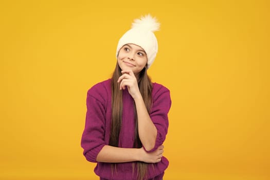Winter hat. Cold season concept. Winter fashion accessory for children. Teen girl wearing warm knitted hat