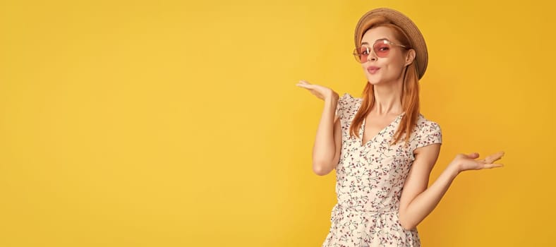 Woman isolated face portrait, banner with copy space background. positive young woman in straw hat and sunglasses on yellow background