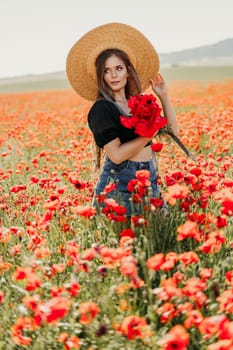 Woman poppies field. portrait of a happy woman with long hair in a poppy field and enjoying the beauty of nature in a warm summer day