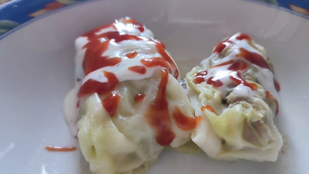 food cabbage rolls, mayonnaise sauce and ketchup. High quality photo