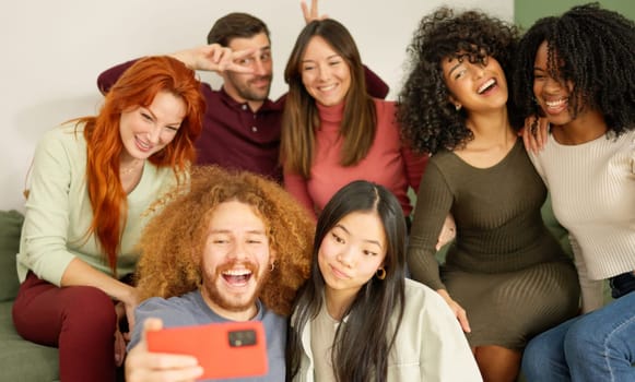 Diverse multi-ethnic friends taking a selfie at home
