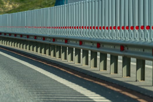 Safety barriers on highway. Anodized safety steel barrier. Enhancing highway safety