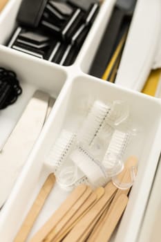 Manicure and pedicure tools. Nail file and cuticle pusher orange wood sticks. Top view.