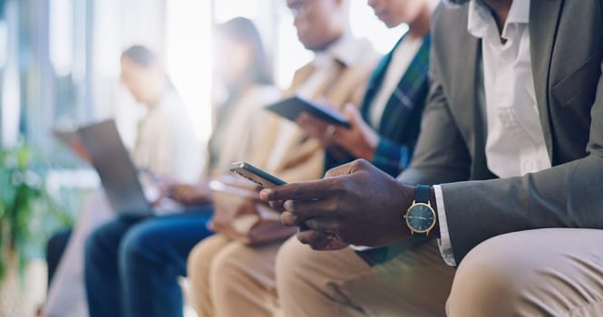 Recruitment, hiring and phone with hands of business people in waiting room for networking, social media and job interview. Technology, communication and meeting with closeup of employees in office.