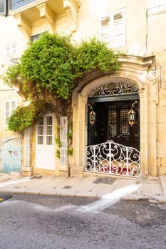 Valletta, Malta, April 03, 2024.  external view of the typical entrance doors of houses in the city center