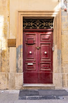 Valletta, Malta, April 03, 2024.  external view of the typical entrance doors of houses in the city center