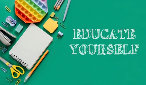 A green background with a notebook, pens, scissors, and a stress ball. The words educate yourself are written in white on the background