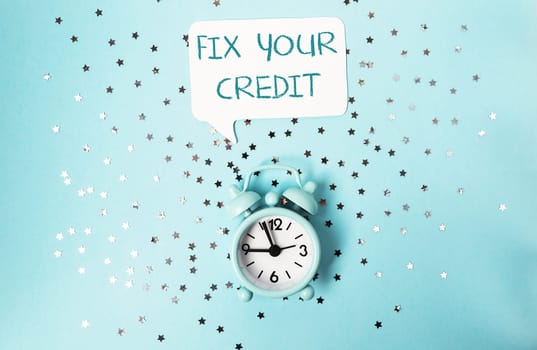 A clock with the words Fix Your Credit above it, representing the concept of sound financial management and credit repair.