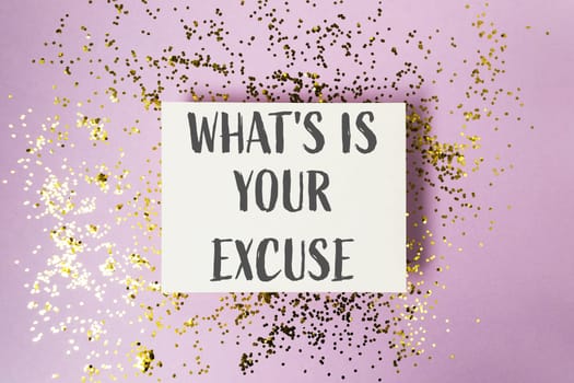 A white card adorned with golden glitter, bearing the motivational message What's your excuse, inspiring action and accountability.