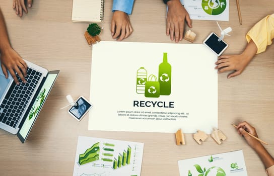 Recycle packaging placed on a meeting table during a green business meeting discussion. ESG environment social governance and Eco conservative concept. Top view. Delineation.