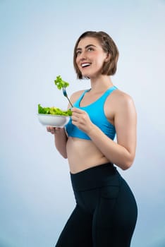 Full body length gaiety shot athletic and sporty young woman with healthy vegan food in standing posture on isolated background. Healthy active and body care by vegetarian lifestyle.