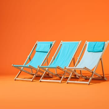 Three outdoor chairs are arranged in a line on a sunny orange background. The furniture includes folding chairs perfect for relaxation under the shade of a beach umbrella