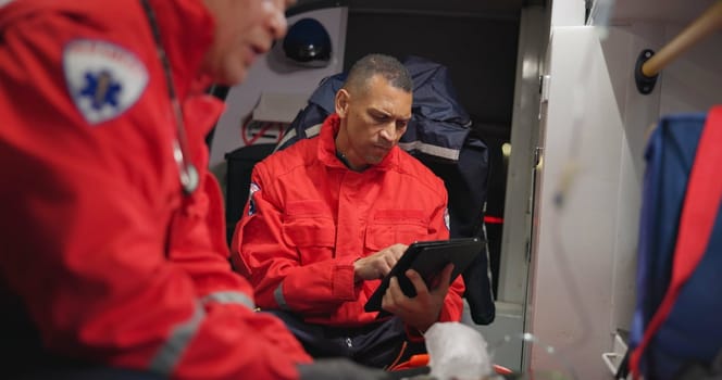 Ambulance, patient and paramedic with tablet for healthcare with technology, communication and doctor update. Ems, accident and victim with oxygen mask, digital medical service and transportation.