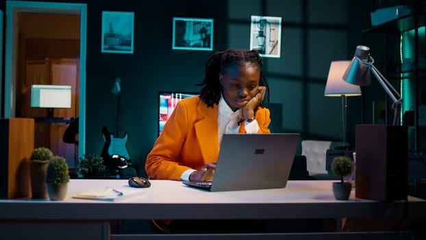 Student working under pressure to finish homework at midnight, trying to respect deadline. Girl rubbing eyes and solving tasks while feeling exhausted, dealing with burnout syndrome. Camera B.