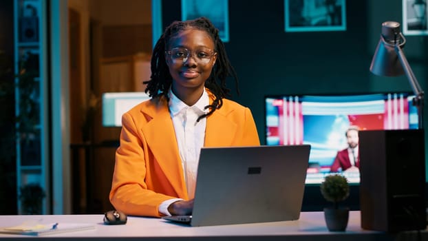 Portrait of dedicated pupil studying class materials and notes to increase knowledge, working from home on her projects. Student researching for assignments using web libraries. Camera A.