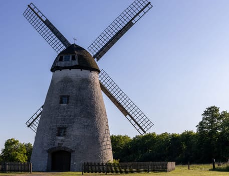 Beautiful view of an old abandoned windmill in a city park in Germany, close-up side view.